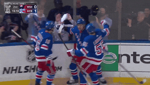 a hockey game is being played between the new york rangers and the washington redskins