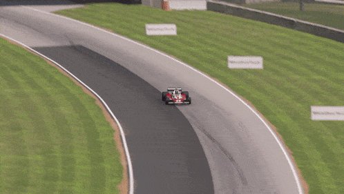 a red race car with the number 11 on the front