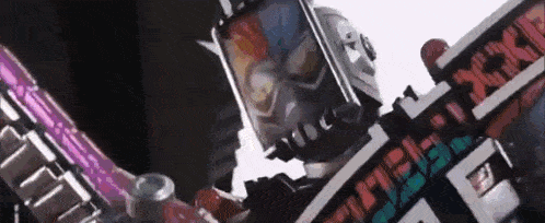 a close up of a robot with a sword and a mask on .