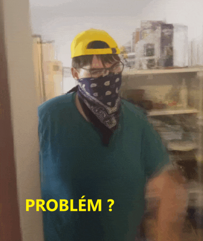 a man wearing a bandana and a yellow hat has the word problem written below him