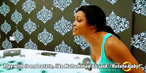 a woman in a bathtub says play with it and rotate like muhammad ali