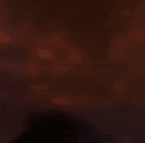 a purple and yellow light is coming out of a projector
