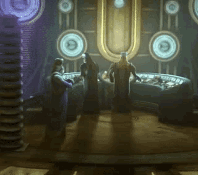 a group of people are standing in a room with circles on the walls