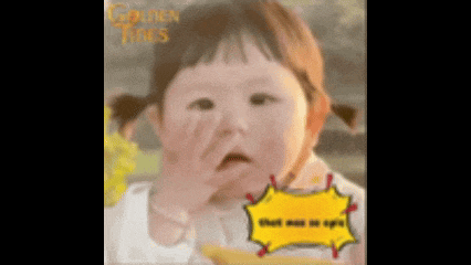 a baby girl with pigtails is making a funny face with her hand on her face .