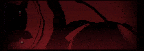 a computer screen shows a red background with a few lines and a few words