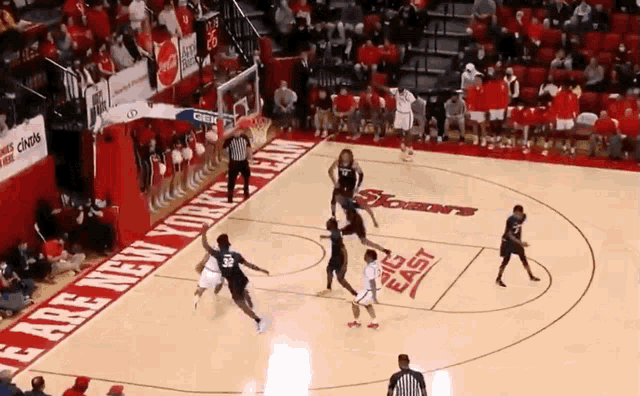 a basketball game is being played on a court that says east