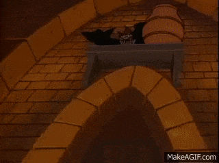 a cartoon character with a large mouth is standing next to a barrel