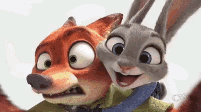 a fox and a rabbit from zootopia are taking a selfie .