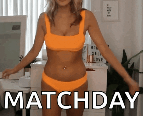 a woman in a bikini is standing in front of a mirror with the words matchday below her