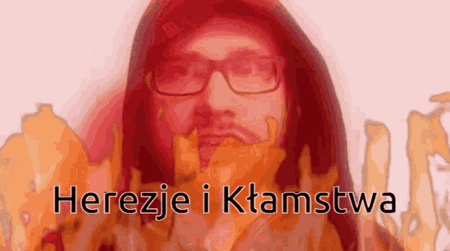 a man with glasses is surrounded by flames and the words herezje i ktamstwa