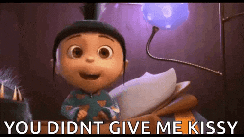 a little girl from despicable me is smiling and saying you did n't give me kissy