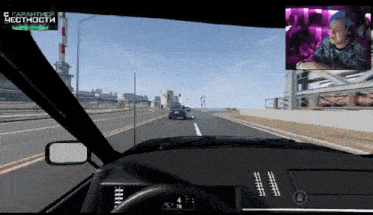 a video game is being played in a car with a man in the background
