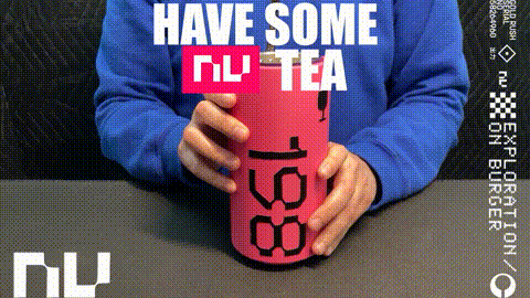 a person is holding a red bottle that says have some tea