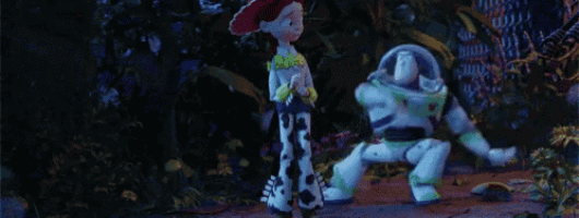 buzz lightyear and jessie from toy story are standing next to each other in the woods .