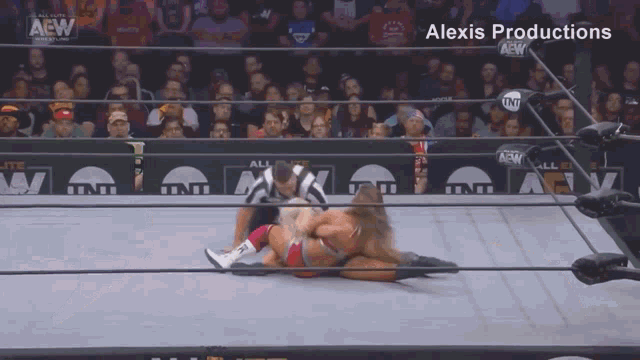a wrestling match is being shown on alexis productions television
