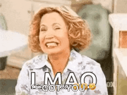 a woman is laughing with her eyes closed and the words `` lmao yea got you '' written on her face .