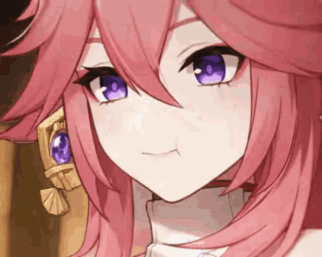 a close up of a pink haired anime girl with purple eyes making a funny face .