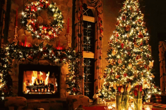 two christmas trees in front of a fireplace with a wreath on it