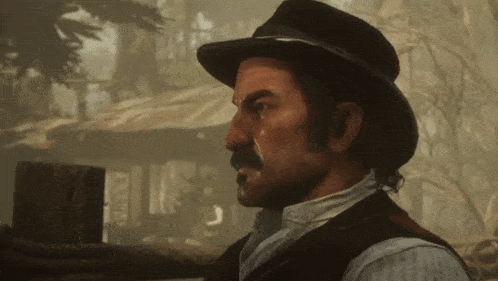 a man with a mustache wearing a hat and a vest
