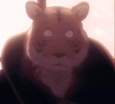 a close up of a stuffed animal with a tiger face