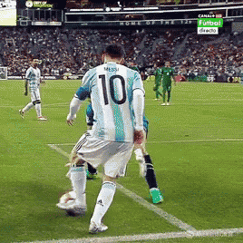 a soccer player wearing a number 10 jersey kicks the ball