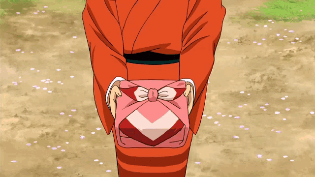 a person in a red kimono is holding a pink wrapped gift
