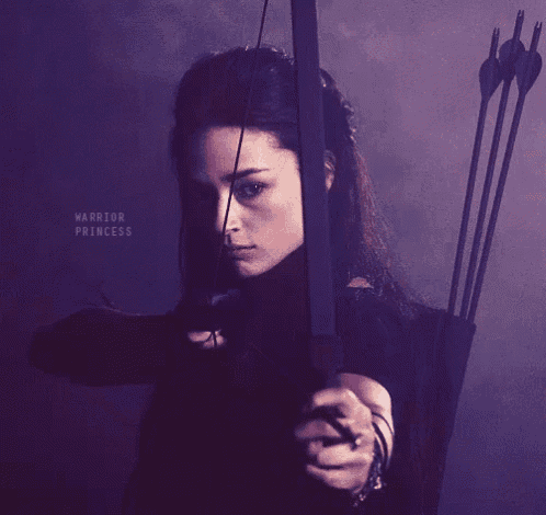 a woman is holding a bow and arrow with the words warrior princess written on the bottom
