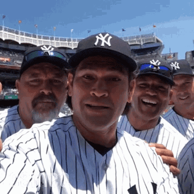 a group of ny yankees baseball players are posing for a picture