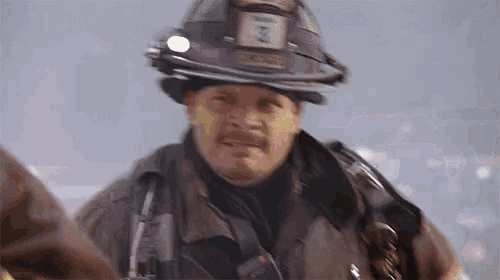 a fireman wearing a helmet has the number 3 on it