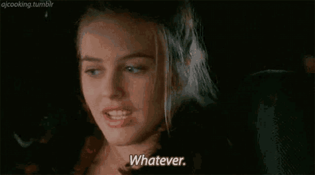 a woman is sitting in the back seat of a car with her eyes closed and says `` whatever '' .
