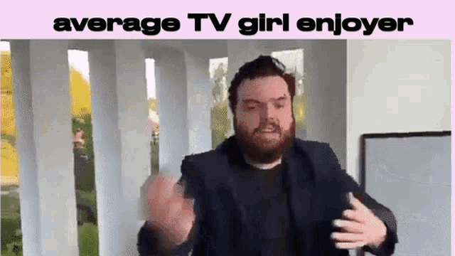 a man with a beard is making a funny face with the words average tv girl enjoyer below him