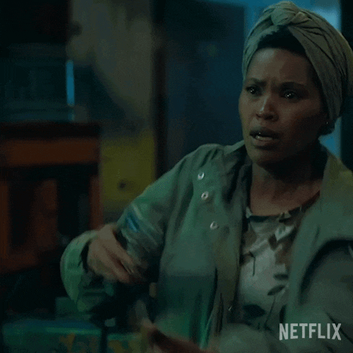 a woman wearing a turban is holding a gun in a netflix ad .