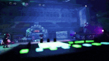 a stage with a disco ball and a sign that says ' roxy '