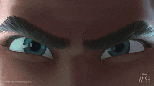 a close up of a man 's eyes from a disney movie