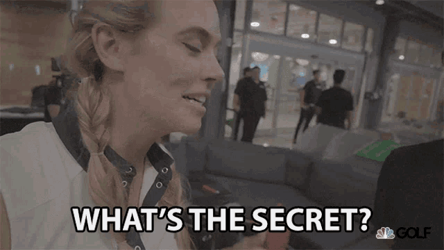 a woman is holding a cell phone and says " what 's the secret "