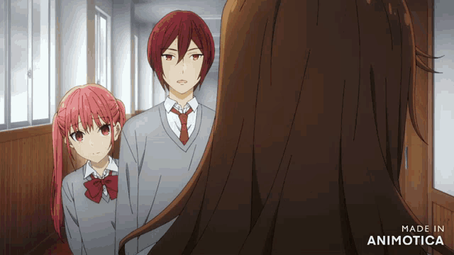 a couple of anime characters are standing next to each other with the words made in animotica on the bottom