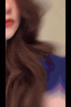 a close up of a woman 's face and hair