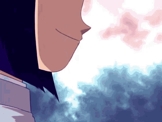 a close up of a person 's face with a cloudy background