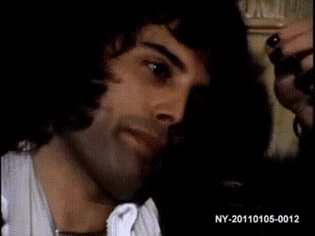 a close up of a man 's face with ny-20100105-0012 on the bottom right