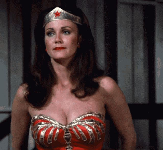 a woman in a wonder woman costume has a red star on her head