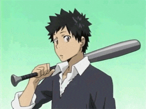 a boy is holding a baseball bat on his shoulder