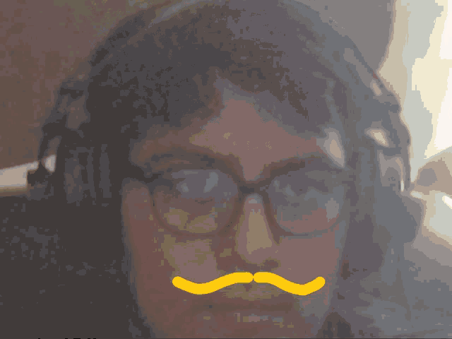 a man wearing glasses and headphones has a yellow mustache and a fireball on his head