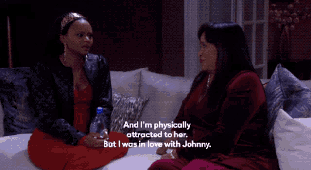 two women sit on a couch and one says " and i 'm physically attracted to her