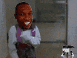 a man in a tuxedo is standing next to a robot