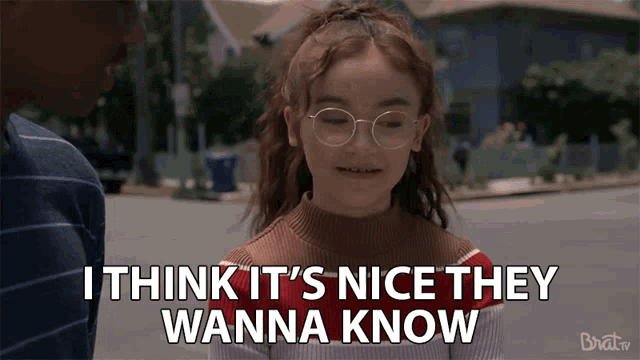 a little girl wearing glasses says i think it 's nice they wanna know