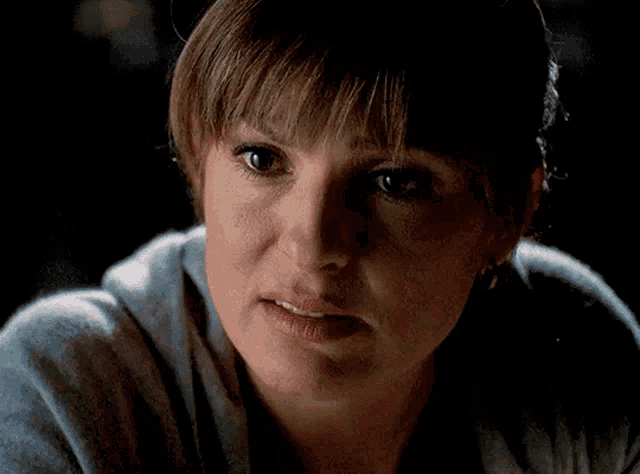 a woman with a serious look on her face