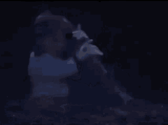 a dark blue background with a few bubbles floating in it