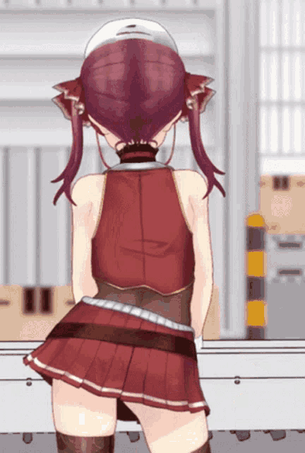 a girl in a red dress is standing in front of a warehouse