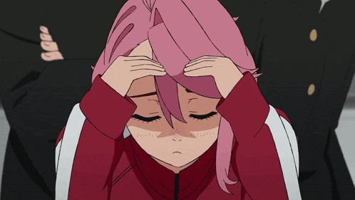 a girl with pink hair is holding her head in her hands