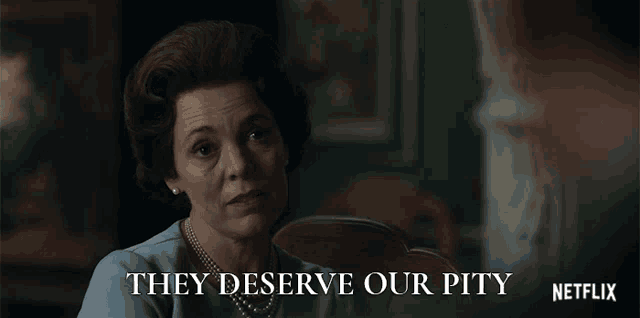 a woman sitting at a table with the words " they deserve our pity " on the bottom